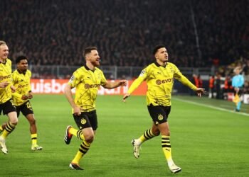 Sancho and Reus Propel Dortmund to Champions League Quarterfinals with 2-0 Victory over PSV Eindhoven