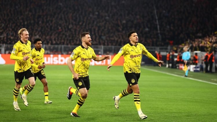 Sancho and Reus Propel Dortmund to Champions League Quarterfinals with 2-0 Victory over PSV Eindhoven